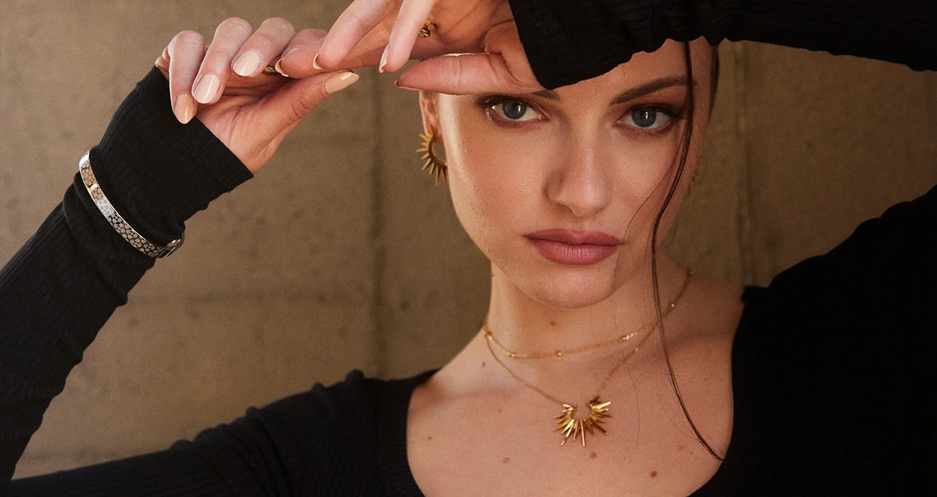 RAWNESS rooftop model wearing jewelry